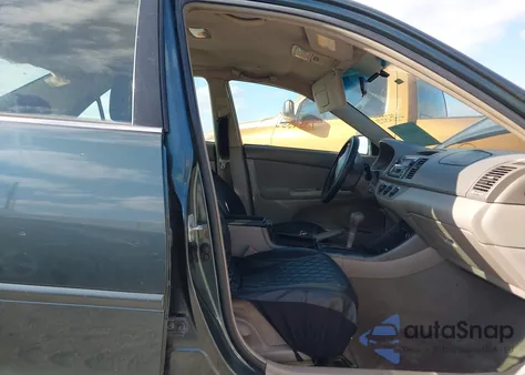 2003 Toyota Camry Le z USA, uszkodzony, nr VIN 4T1BE32K23U773023